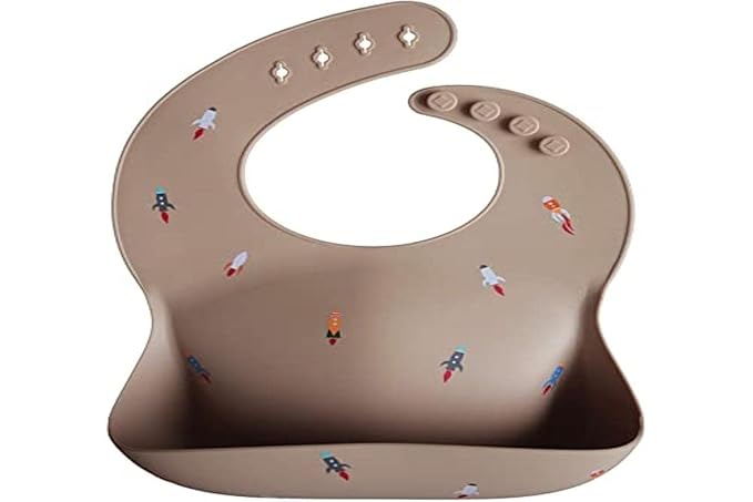 mushie Silicone Baby Bib | Adjustable Fit Waterproof Bibs (Rocket Ship)