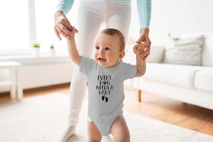 Every Dog Needs a Baby - Funny Baby Essentials Bodysuit - Baby Boy Clothes Newborn Girl Outfits