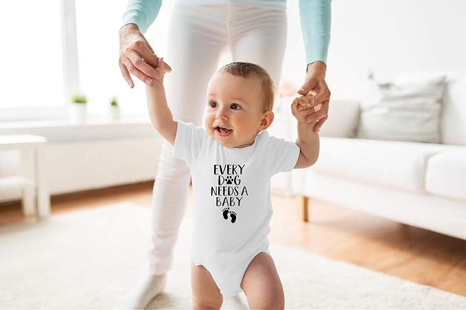 Every Dog Needs a Baby - Funny Baby Essentials Bodysuit - Baby Boy Clothes Newborn Girl Outfits