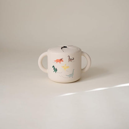 mushie Silicone Snack Cup | Spill Proof Food Container for Toddler and Baby (Dinosaurs)