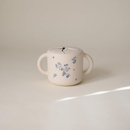 mushie Silicone Snack Cup | Spill Proof Food Container for Toddler and Baby (Lilac Flowers)