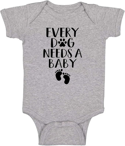 Every Dog Needs a Baby - Funny Baby Essentials Bodysuit - Baby Boy Clothes Newborn Girl Outfits