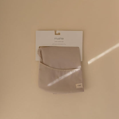 mushie Long Sleeve Baby Bib | Water Resistant Adjustable Fit for Ages 6-24 Months